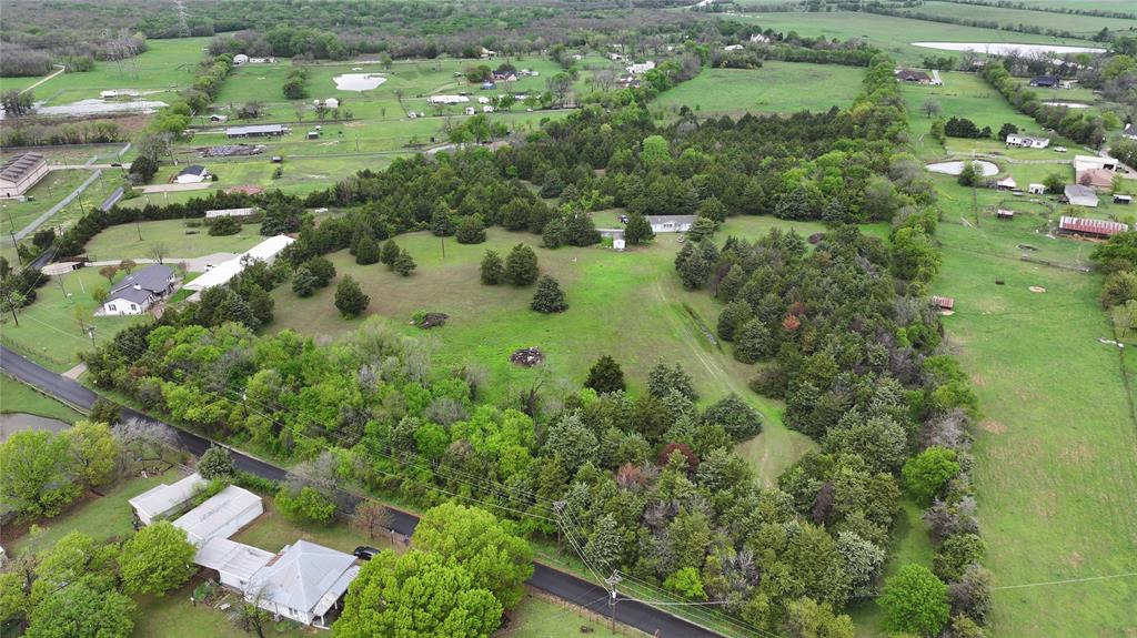 15530 Wiser Road Forney, TX 75126 - Photo 4 of 6 an aerial view of a house with a yard