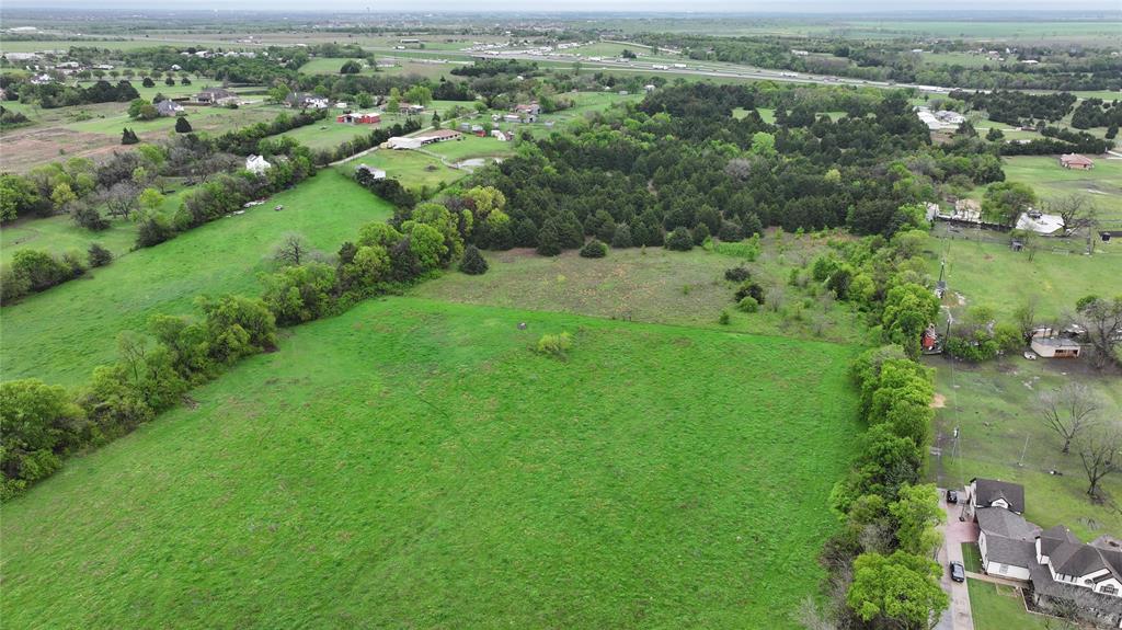 15530 Wiser Road Forney, TX 75126 - Photo 5 of 6 an aerial view of residential houses with outdoor space and trees