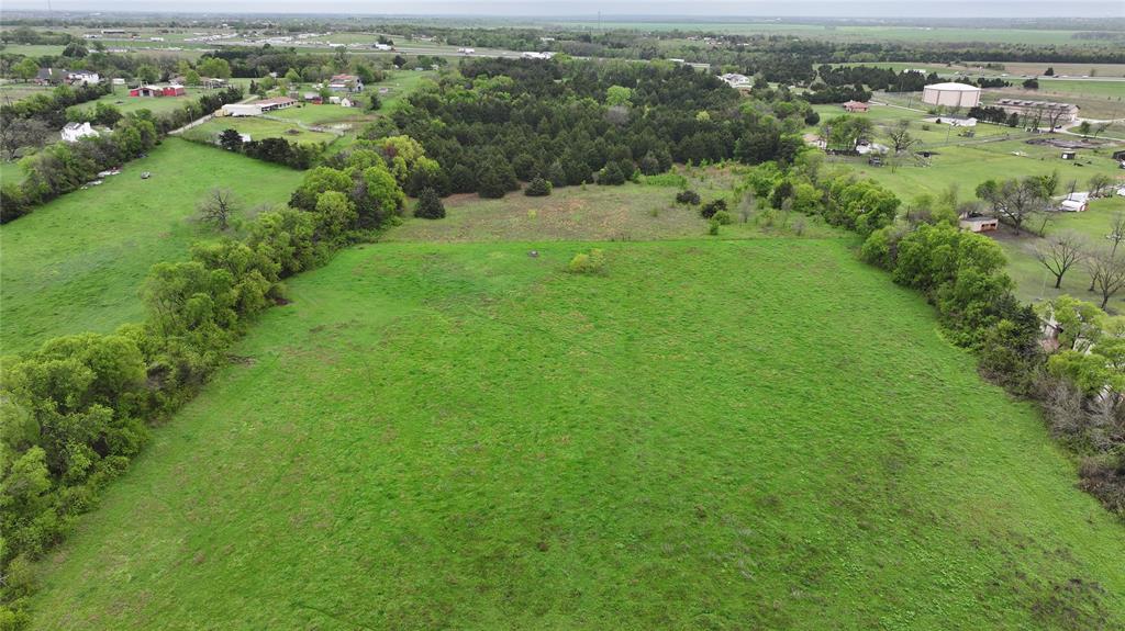 15530 Wiser Road Forney, TX 75126 - Photo 6 of 6 an aerial view of residential houses with outdoor space and trees