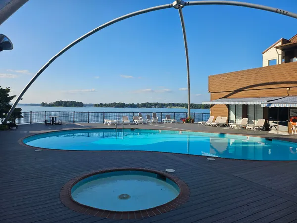 a view of a swimming pool with a chair