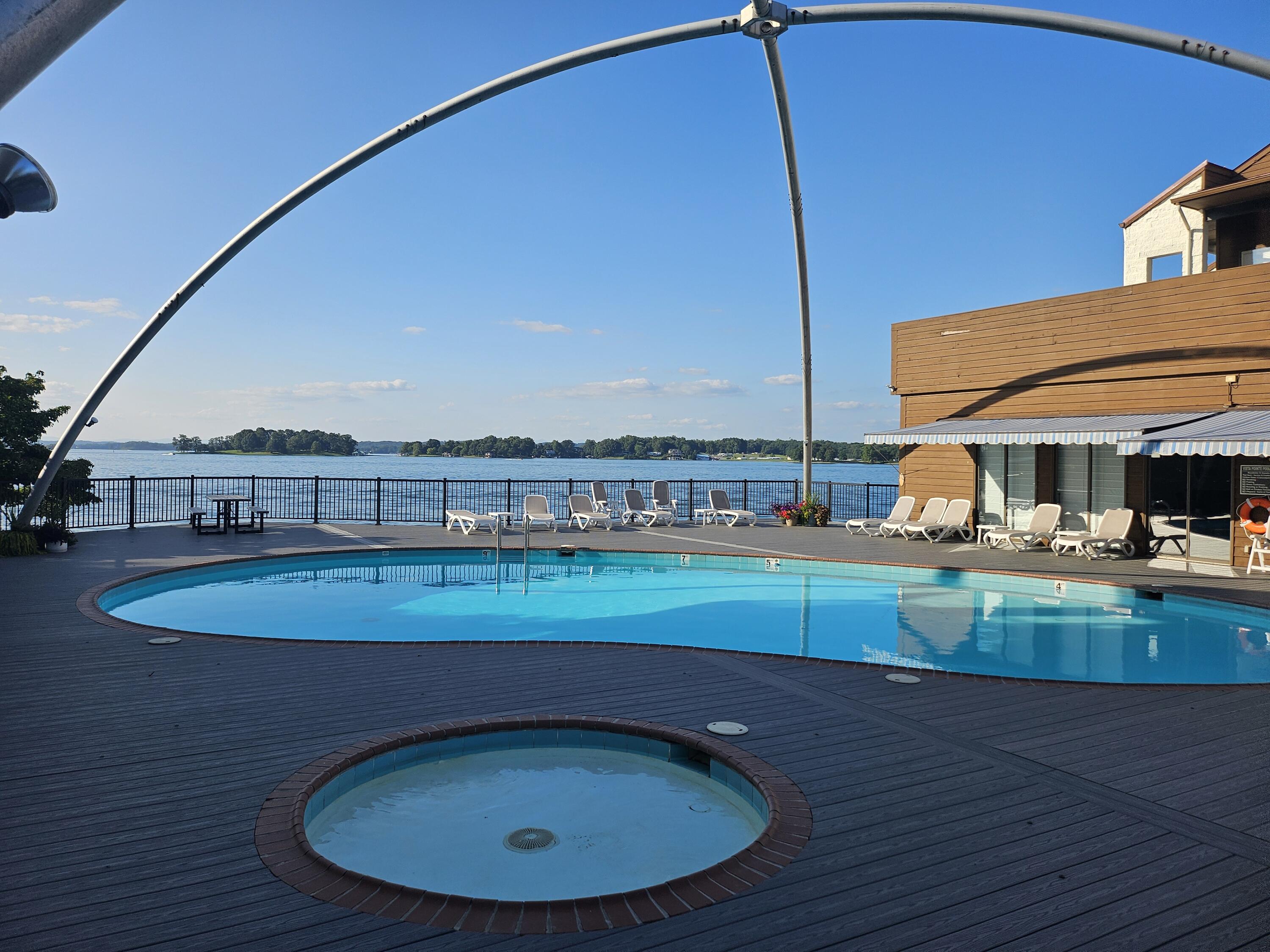 6605 Smith Mountain Road, Unit 101 Penhook, VA 24137 - Photo 4 of 23 a view of a swimming pool with a chair