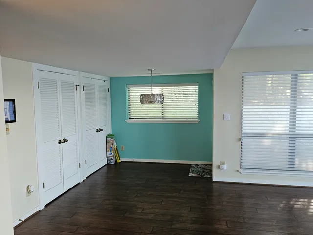 a view of room with window and hardwood floor