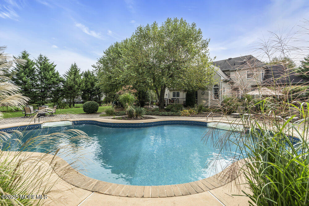 a view of a swimming pool with a patio