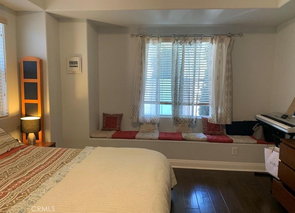 719 Arcadia Avenue, Unit B Arcadia, CA 91007 - Photo 16 of 23 a bedroom with a bed and wooden floor