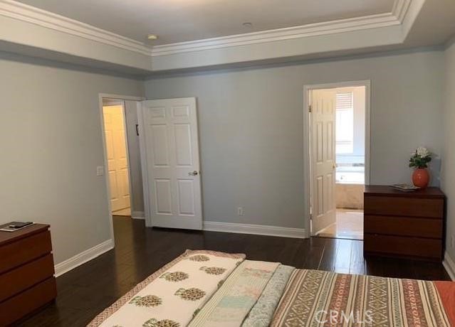 719 Arcadia Avenue, Unit B Arcadia, CA 91007 - Photo 17 of 23 a bedroom with a bed and wooden floor