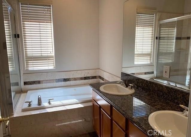719 Arcadia Avenue, Unit B Arcadia, CA 91007 - Photo 19 of 23 a bathroom with a granite countertop sink and a bathtub