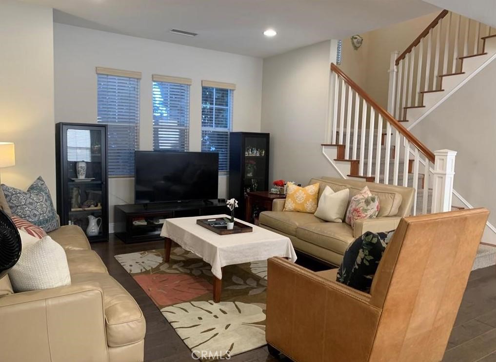 719 Arcadia Avenue, Unit B Arcadia, CA 91007 - Photo 4 of 23 a living room with furniture a flat screen tv and a refrigerator