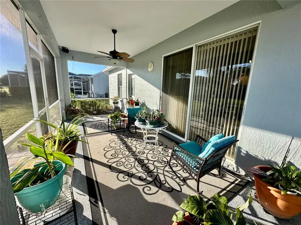 a view of a balcony with yard