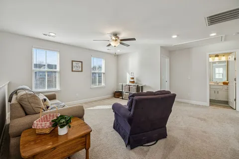 a living room with furniture and windows