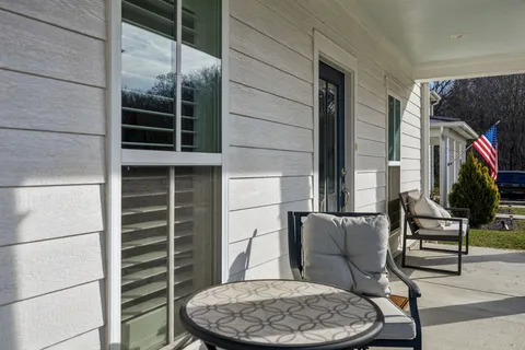 a view of balcony with furniture