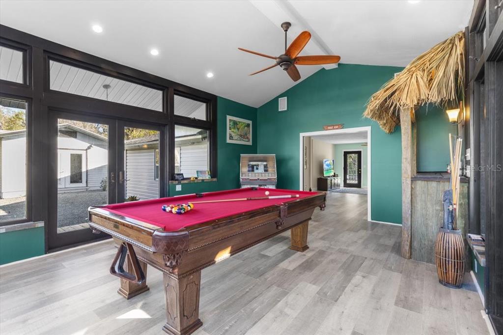 7226 Alafia Ridge Loop Riverview, FL 33569 - Photo 10 of 51 a living room with a pool table and a large window