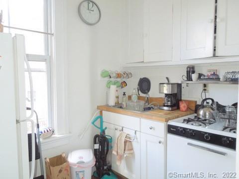 25 High Street, Unit 21 New Haven, CT 06510 - Photo 3 of 6 a view of a kitchen with sink and washing machine