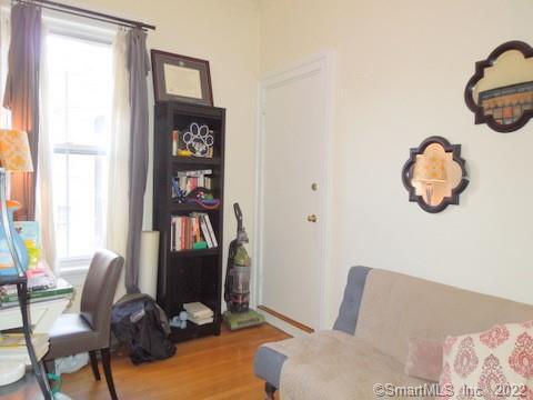 25 High Street, Unit 21 New Haven, CT 06510 - Photo 4 of 6 a living room with furniture and a window