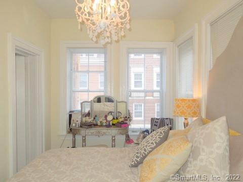 25 High Street, Unit 21 New Haven, CT 06510 - Photo 6 of 6 a living room with furniture and a chandelier