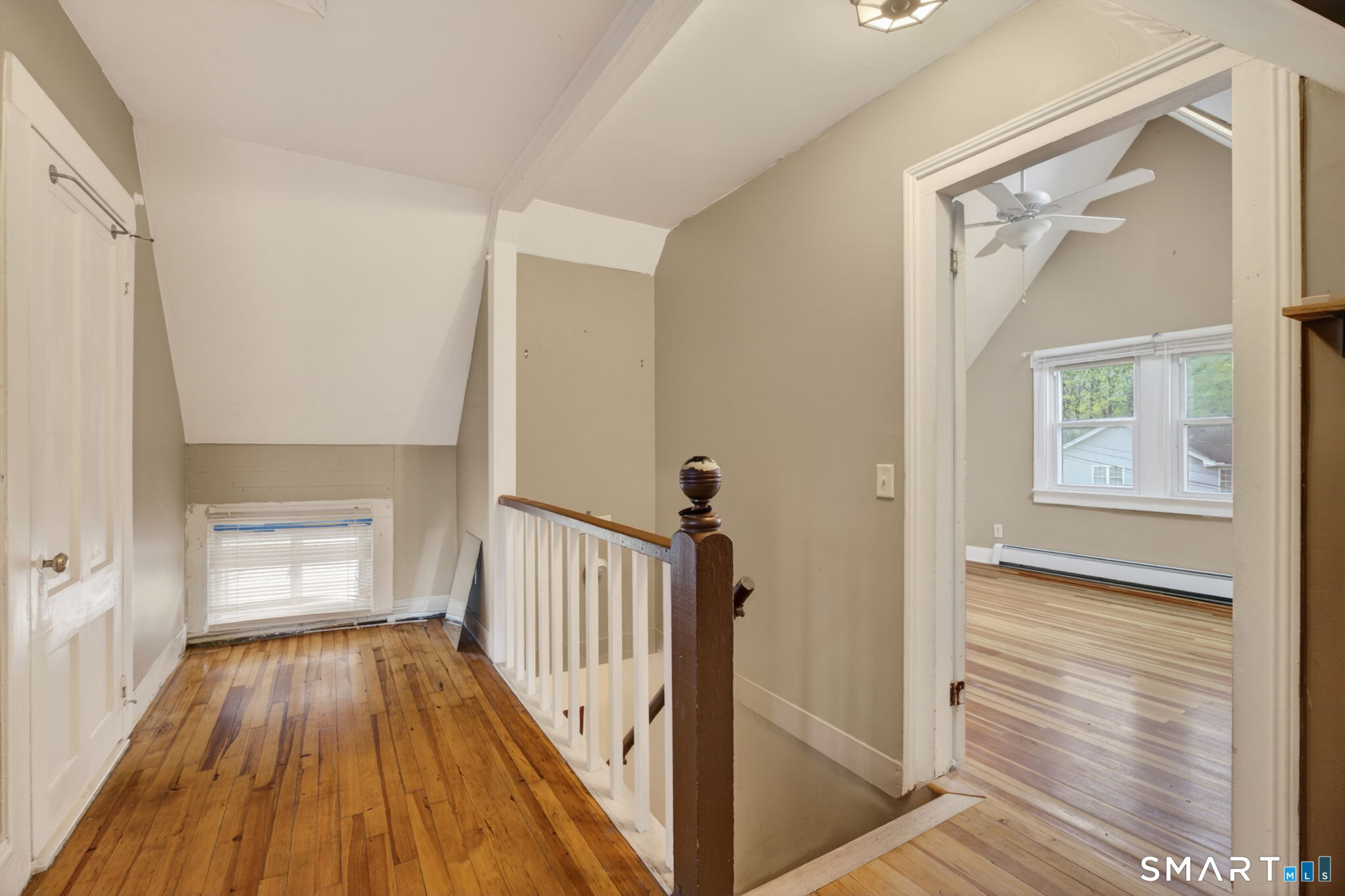 670 Hanover Road Meriden, CT 06451 - Photo 29 of 40 a view of a hallway with wooden floor and staircase