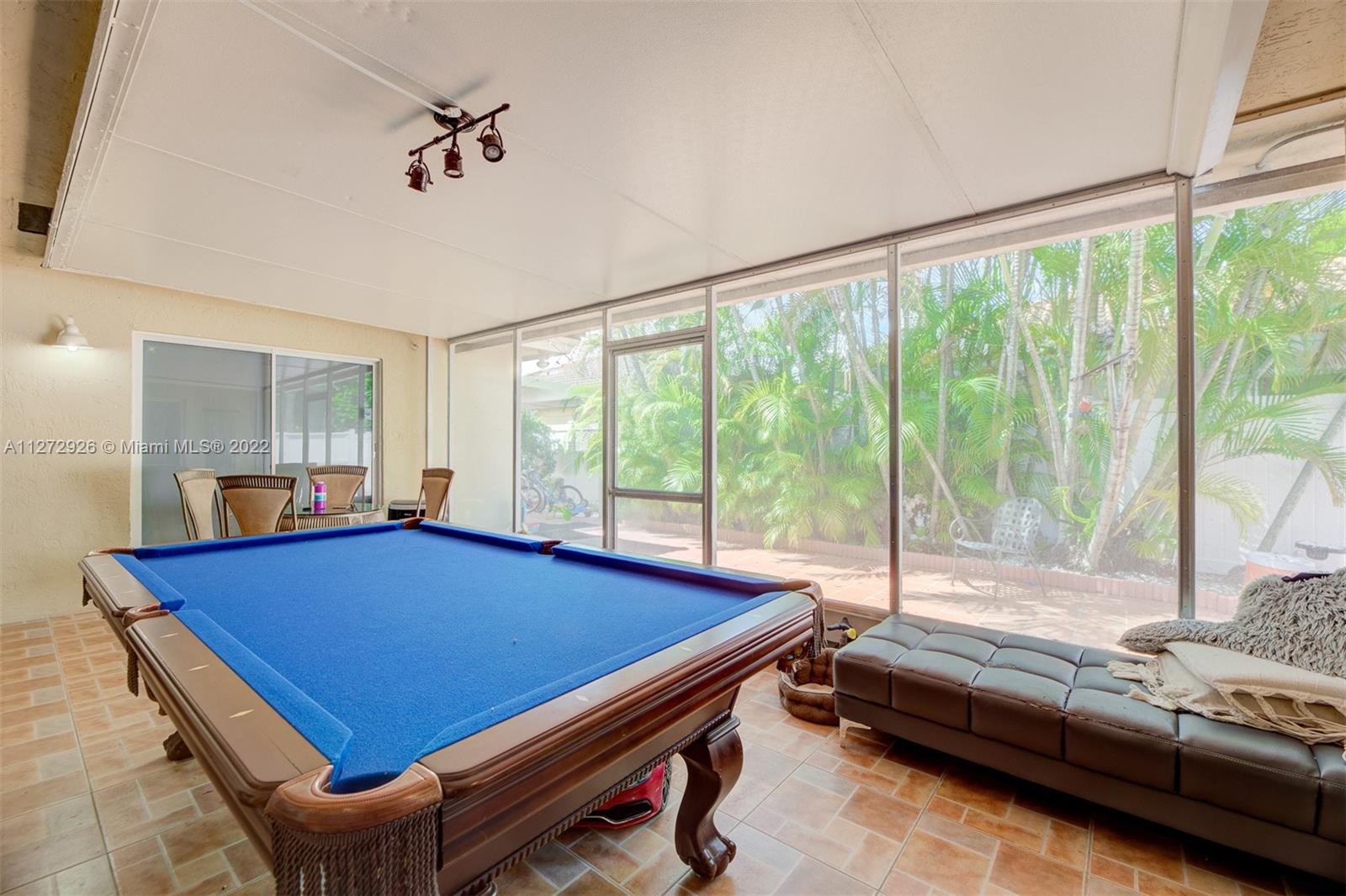 14480 Southwest 112th Street Miami, FL 33186 - Photo 13 of 37 a bedroom with furniture and large windows