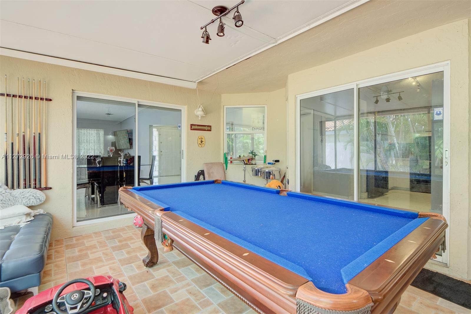 14480 Southwest 112th Street Miami, FL 33186 - Photo 14 of 37 a room with pool table and windows