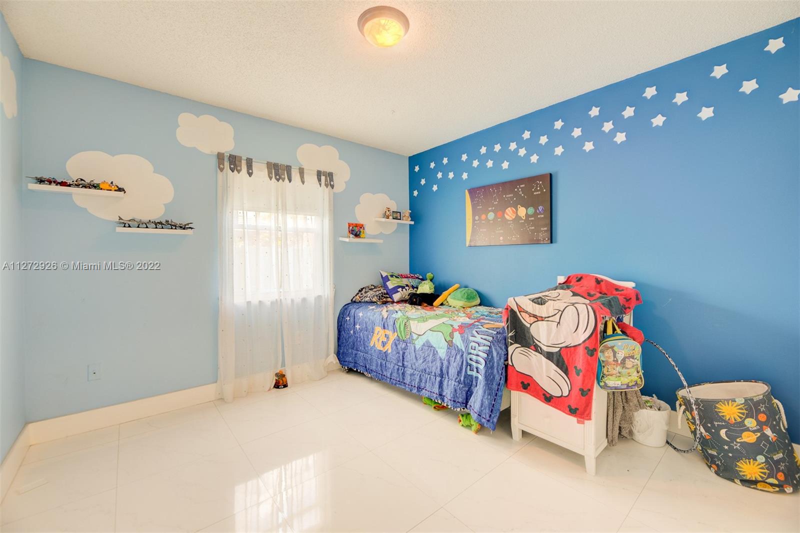 14480 Southwest 112th Street Miami, FL 33186 - Photo 16 of 37 a bedroom with bed and a window