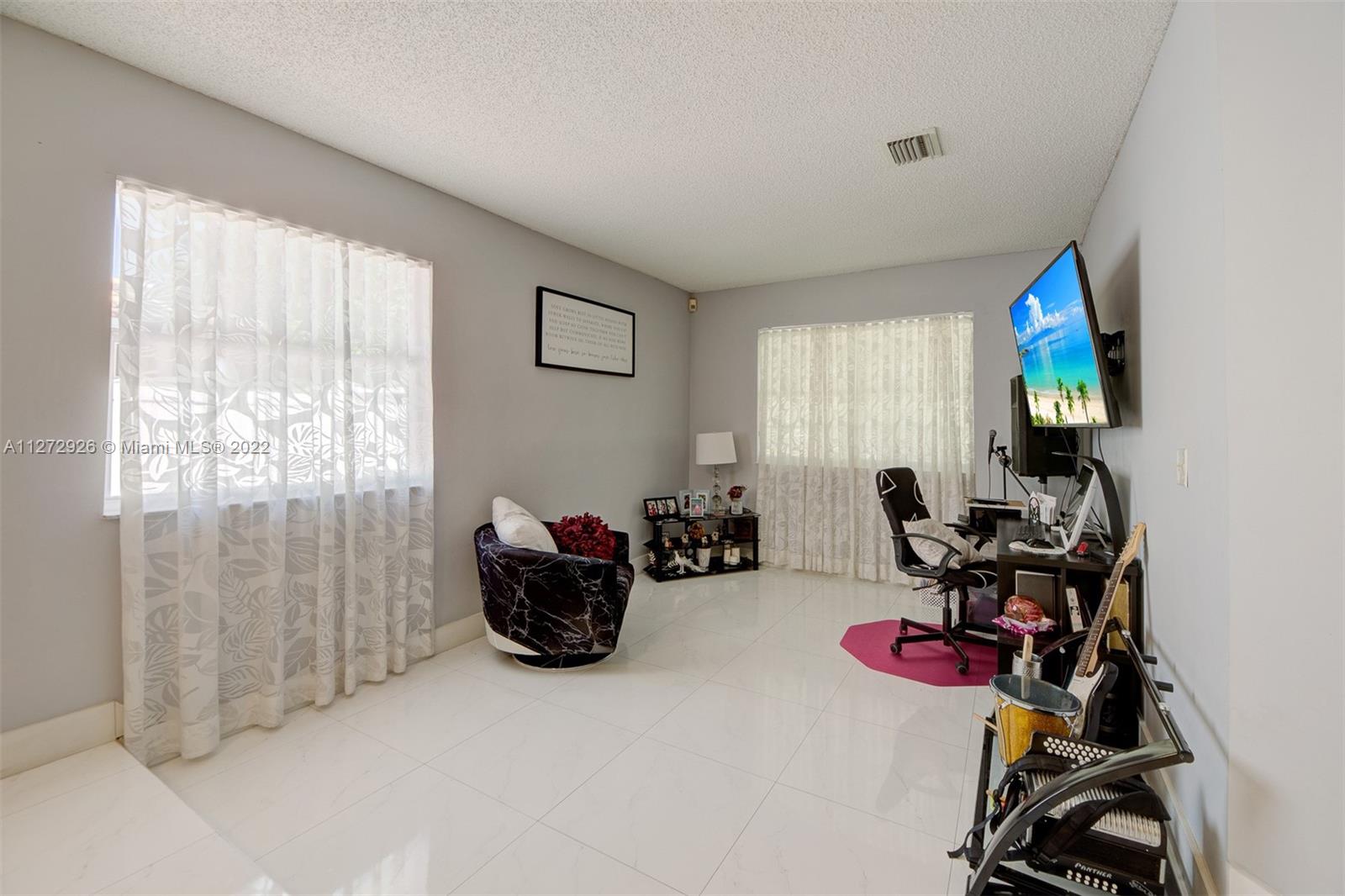 14480 Southwest 112th Street Miami, FL 33186 - Photo 26 of 37 a room with furniture and a window