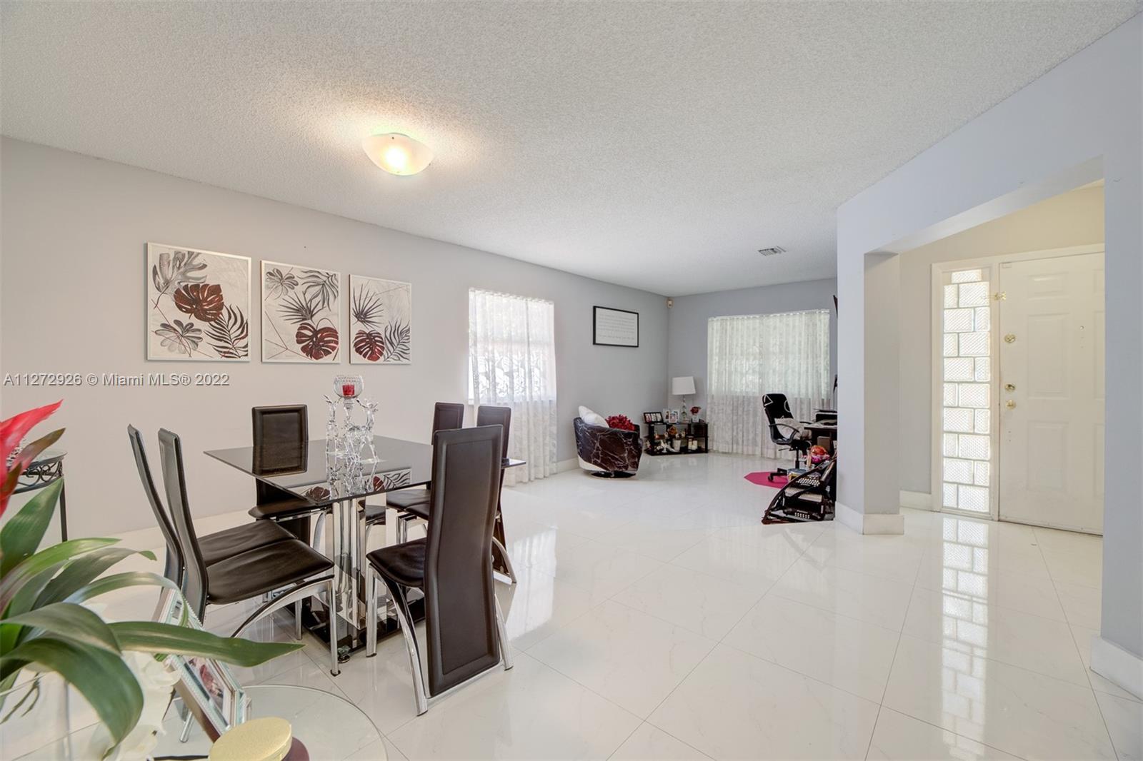 14480 Southwest 112th Street Miami, FL 33186 - Photo 29 of 37 a view of a workspace with furniture and toys