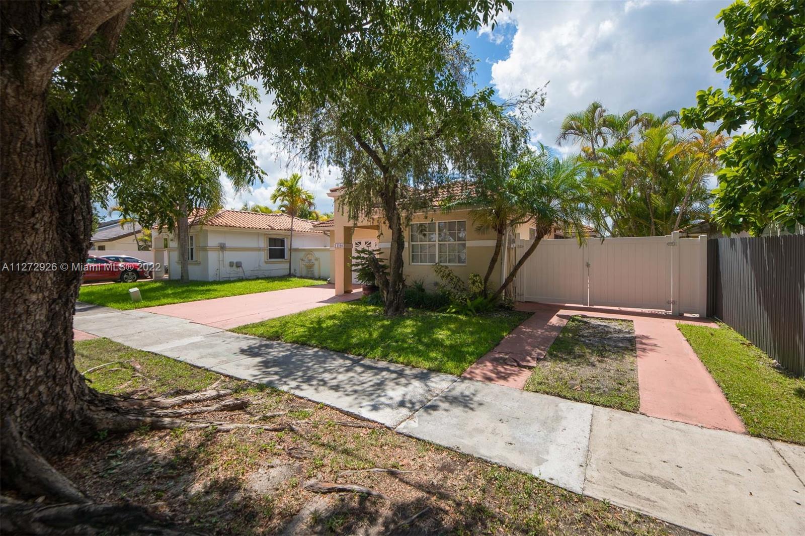 14480 Southwest 112th Street Miami, FL 33186 - Photo 35 of 37 a view of a yard with plants and a trees