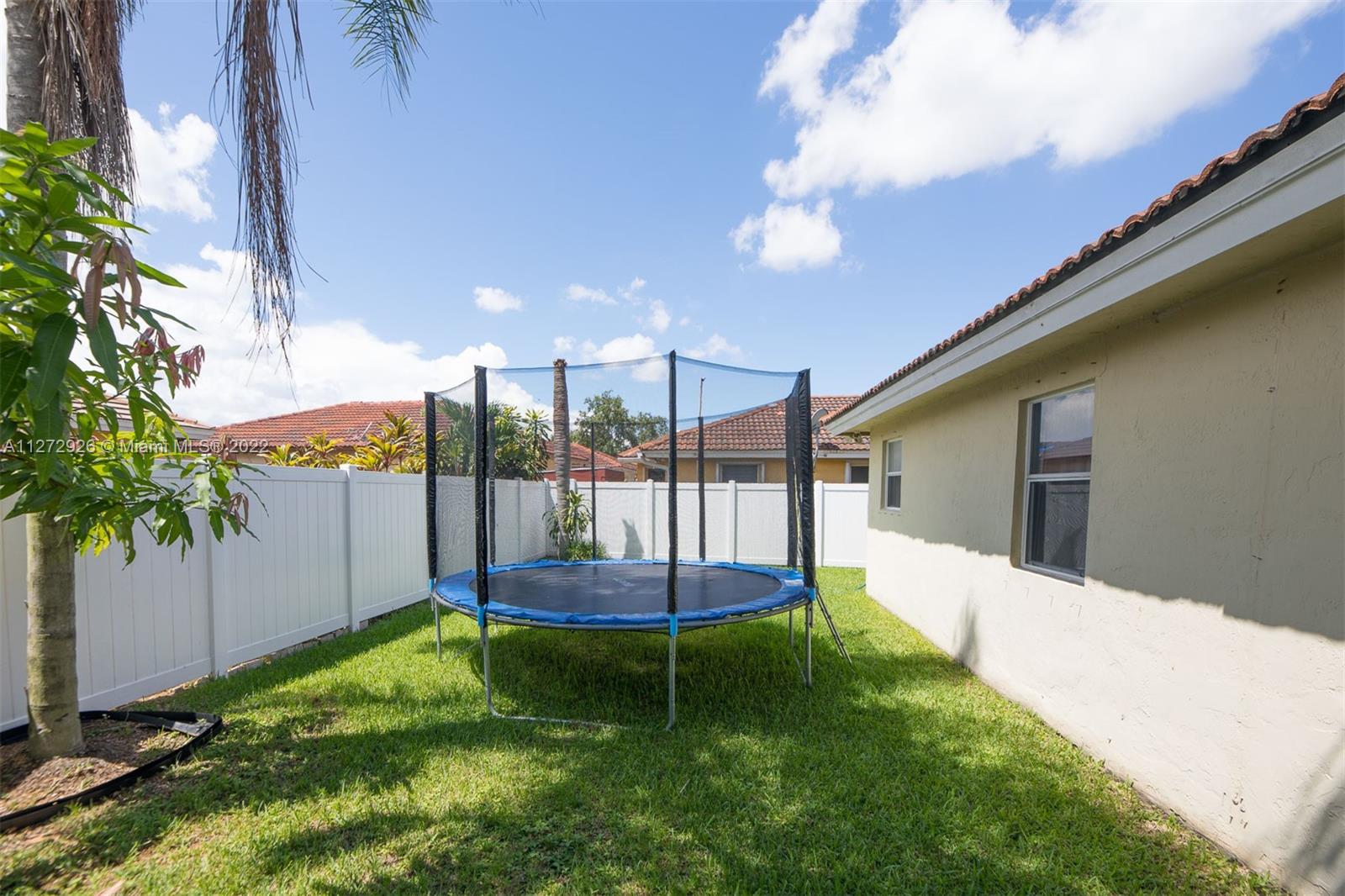 14480 Southwest 112th Street Miami, FL 33186 - Photo 6 of 37 a view of a backyard with a staircase