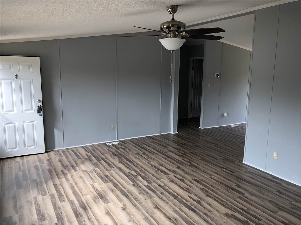 8894 Creek Road Willow Spring, NC 27592 - Photo 3 of 25 Gorgeous Custom Laminate Hardwood throughout Majority of Home!
