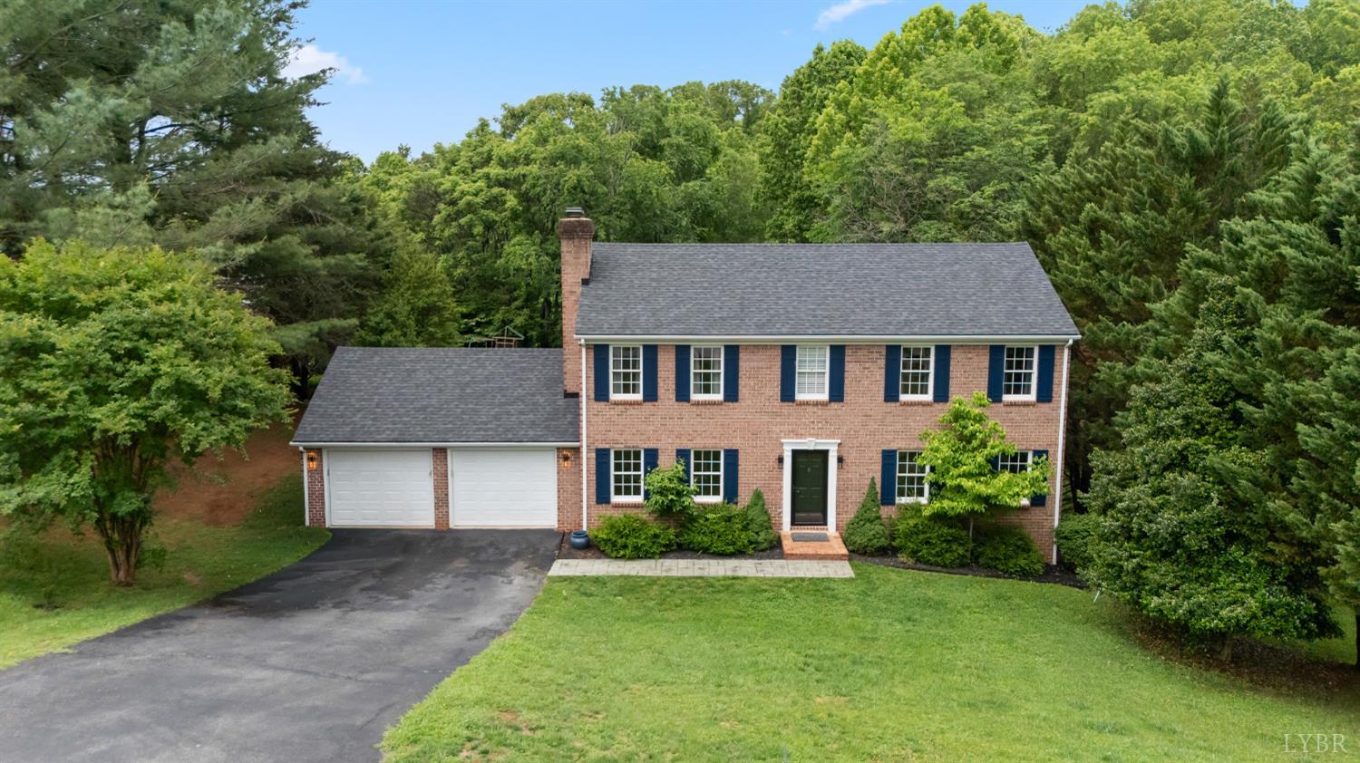 a aerial view of a yard in front of a house