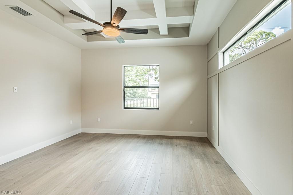 3552 Hibiscus Avenue Naples, FL 34104 - Photo 20 of 34 an empty room with a window and a ceiling fan