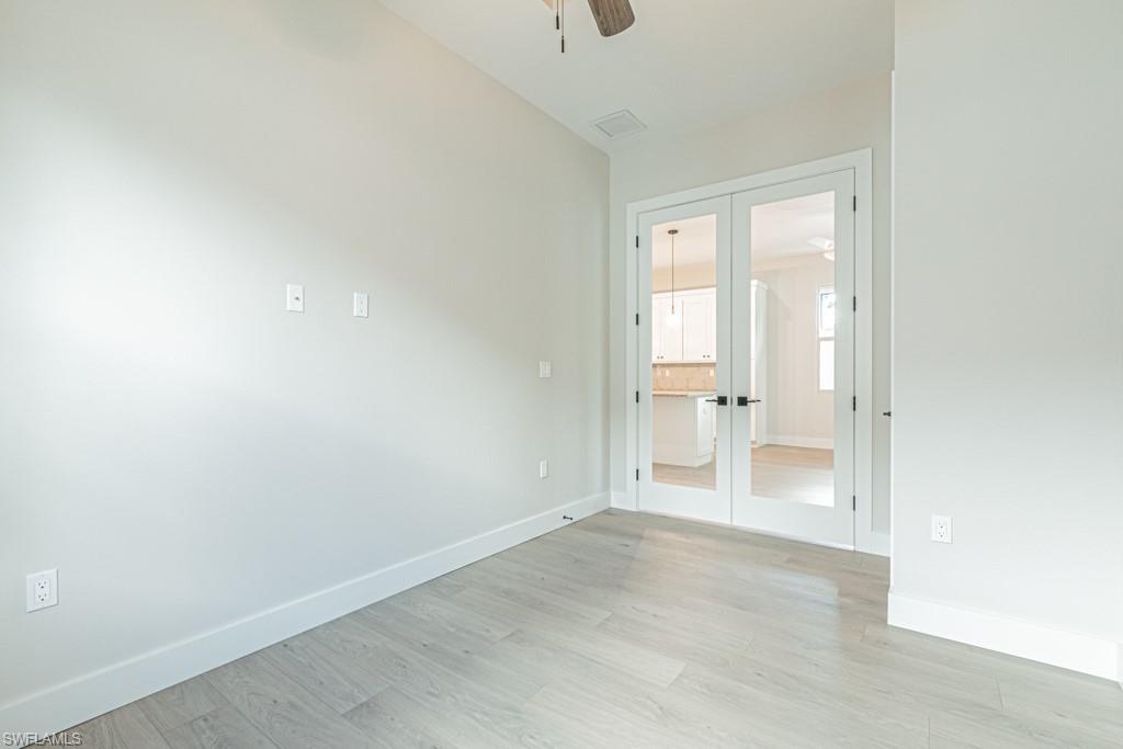 3552 Hibiscus Avenue Naples, FL 34104 - Photo 29 of 34 a view of empty room with wooden floor