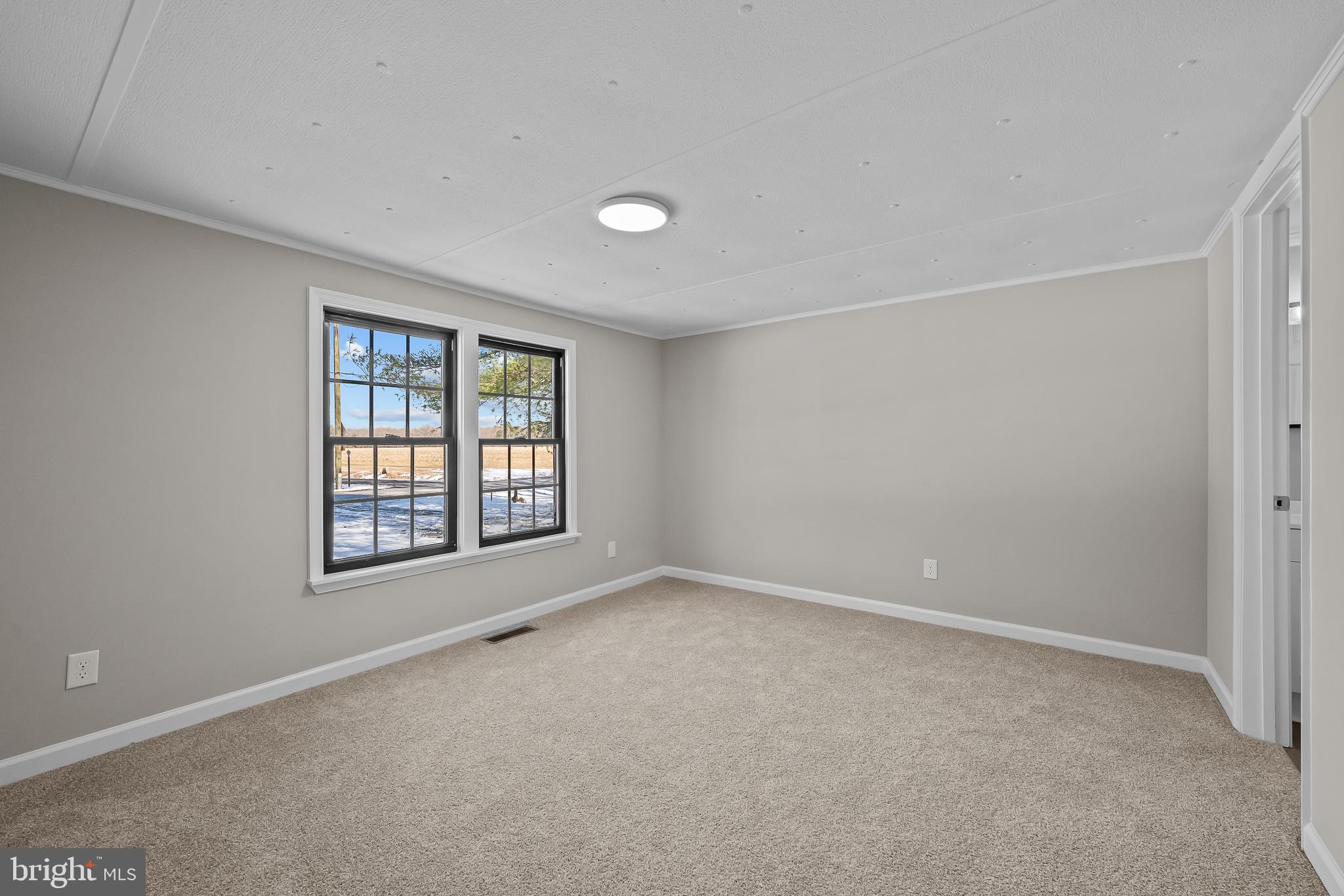 14018 Oak Branch Road Delmar, DE 19940 - Photo 11 of 20 a view of an empty room with a window