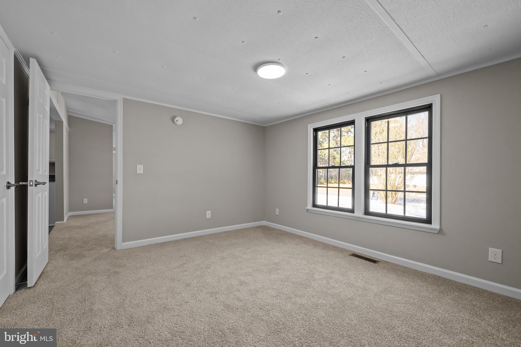 14018 Oak Branch Road Delmar, DE 19940 - Photo 13 of 20 an empty room with windows