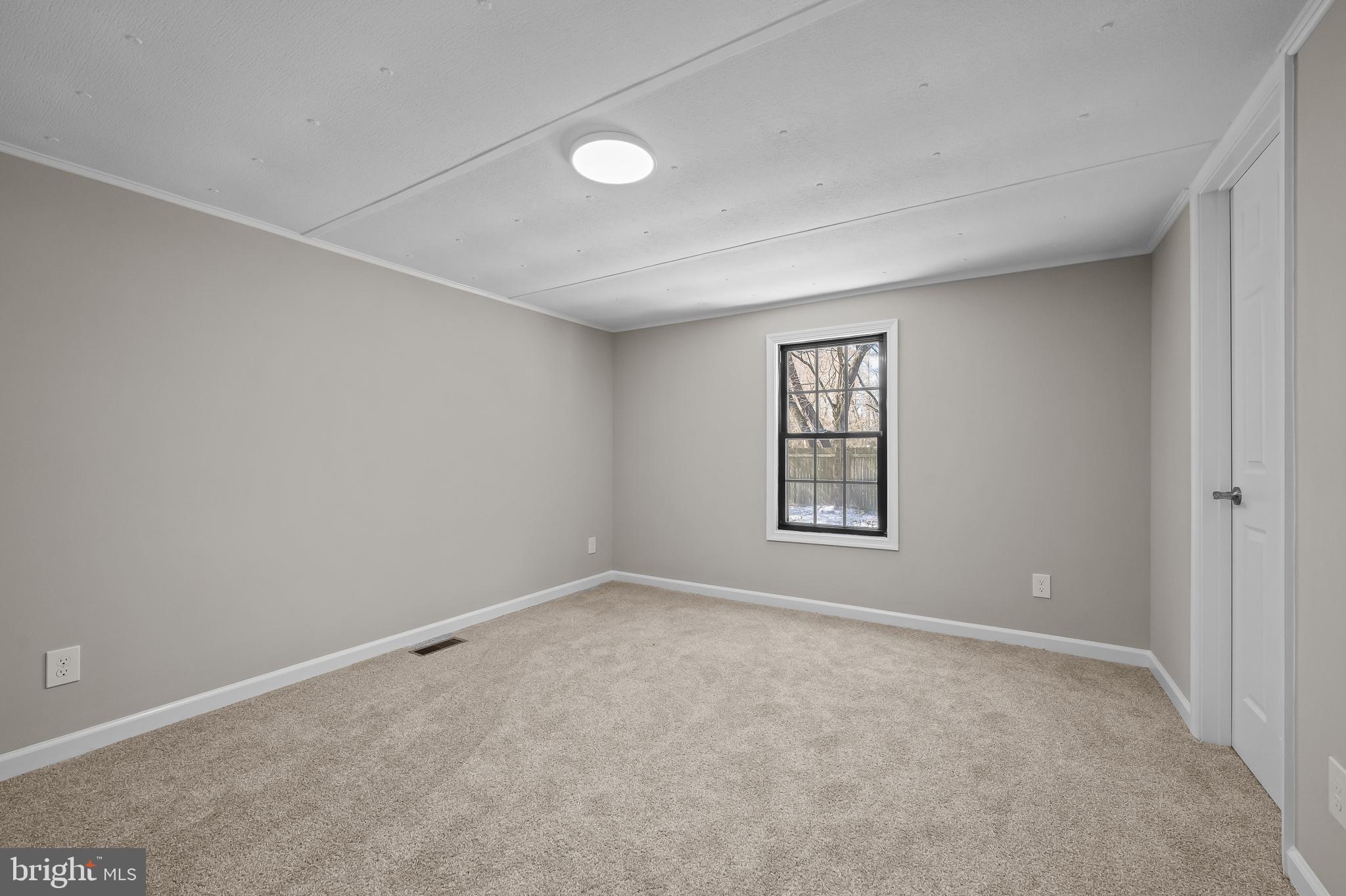 14018 Oak Branch Road Delmar, DE 19940 - Photo 16 of 20 a view of an empty room with a window