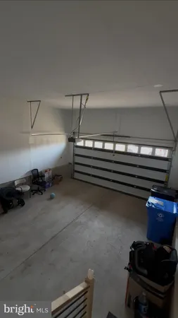 a bathroom with a toilet and a shower curtain