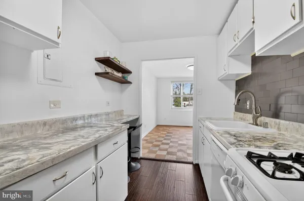 a kitchen with a stove and a sink