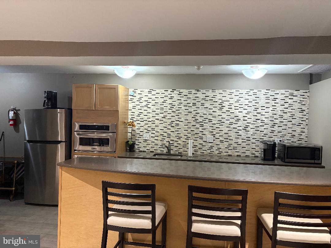1900 Lyttonsville Road, Unit 718 Silver Spring, MD 20910 - Photo 27 of 35 Party Room Kitchen