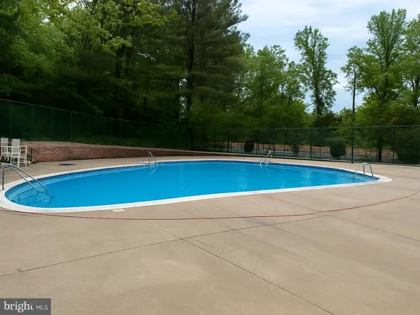 a view of a swimming pool and outdoor space