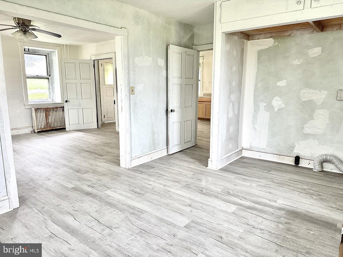 133 Hunter Road Oley, PA 19547 - Photo 11 of 44 a view of a room with wooden floor and windows