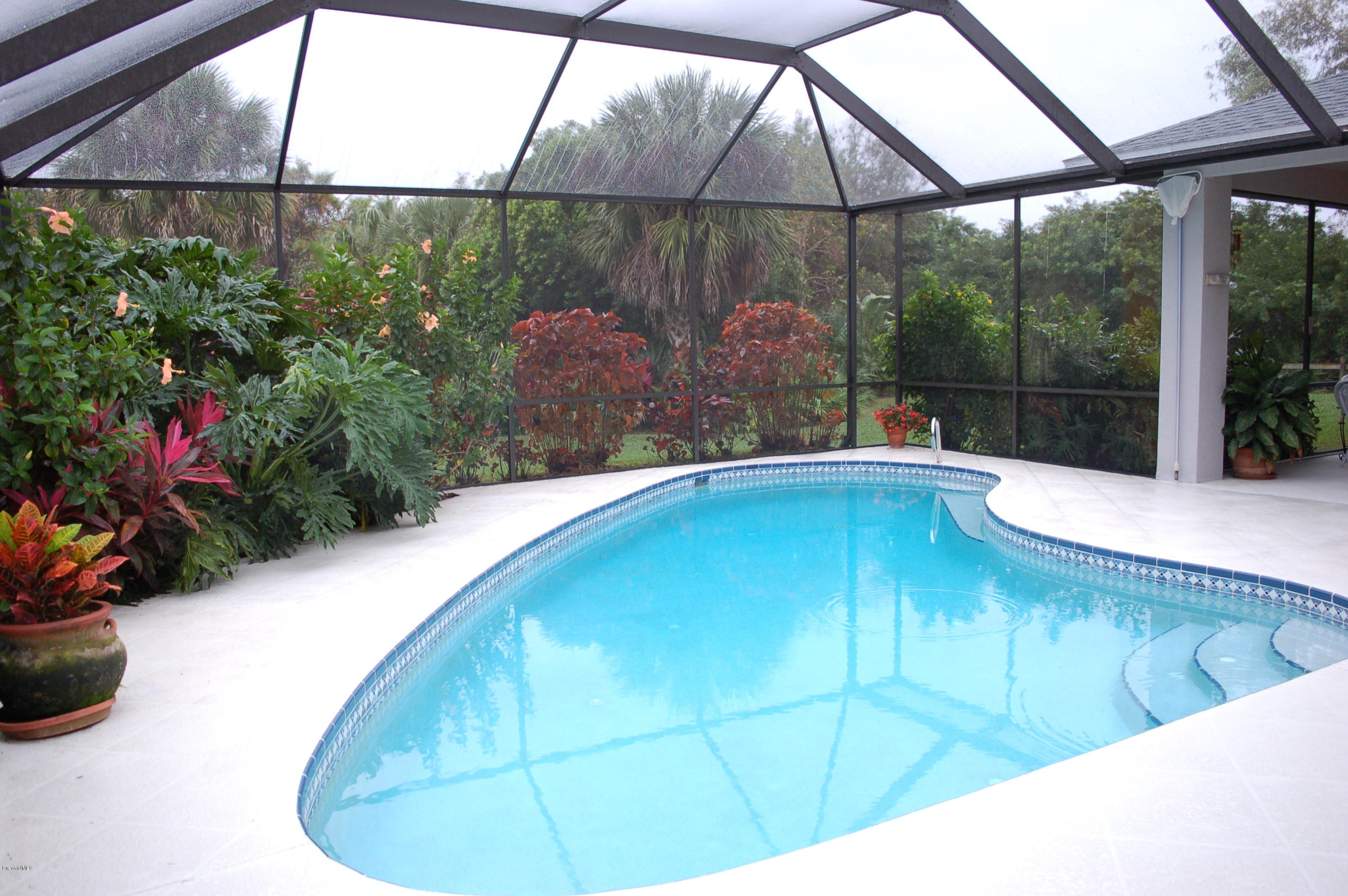 3987 Sparrow Hawk Road Melbourne, FL 32934 - Photo 18 of 21 Screened-In Pool