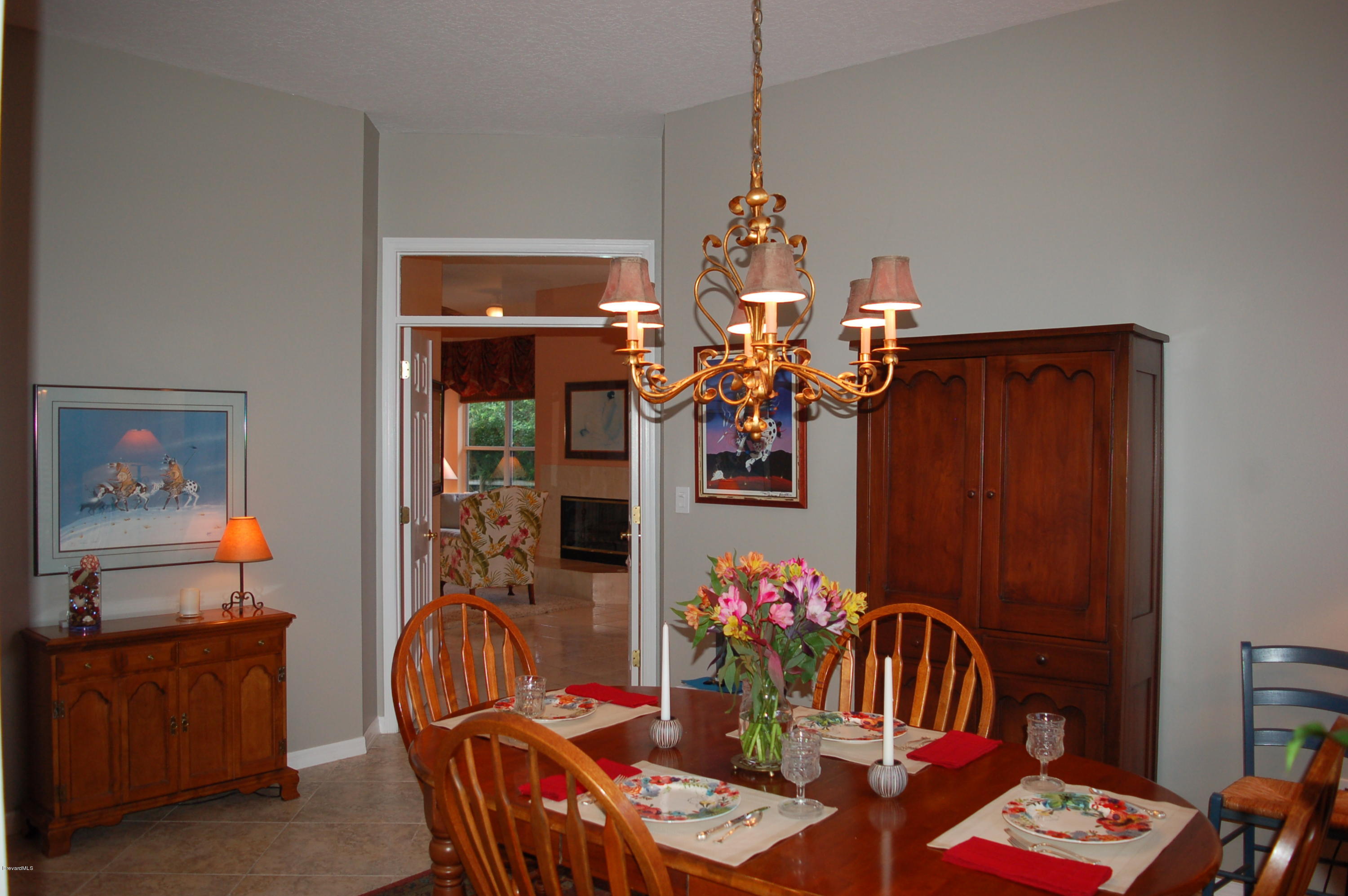 3987 Sparrow Hawk Road Melbourne, FL 32934 - Photo 7 of 21 Dining Rm into Family Rm