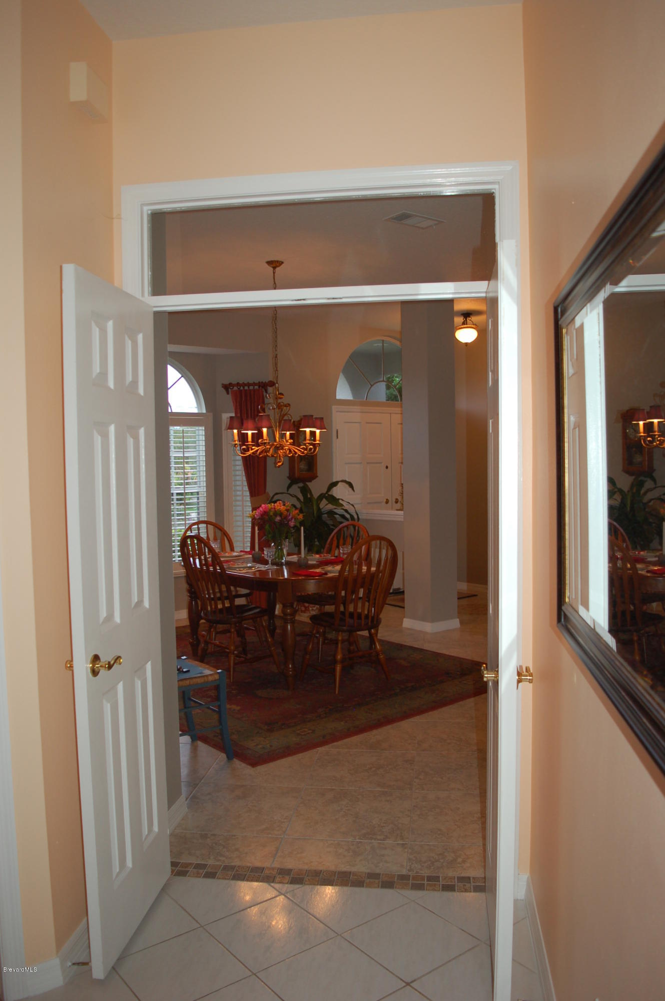 3987 Sparrow Hawk Road Melbourne, FL 32934 - Photo 8 of 21 Double Entry into Dining Rm
