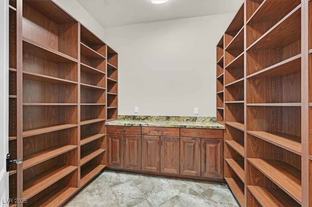5790 Aspen Falls Circle Las Vegas, NV 89149 - Photo 14 of 61 Wine area with stone finish floors