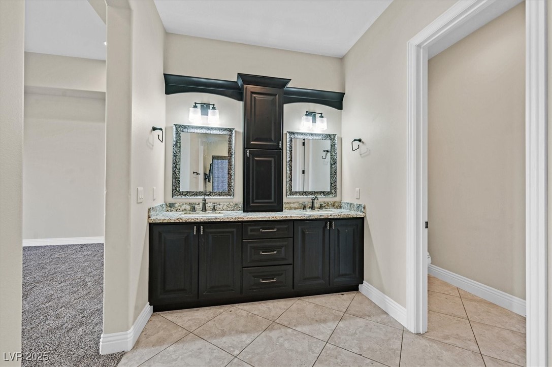 5790 Aspen Falls Circle Las Vegas, NV 89149 - Photo 32 of 61 Full bath with double vanity and tile patterned floors