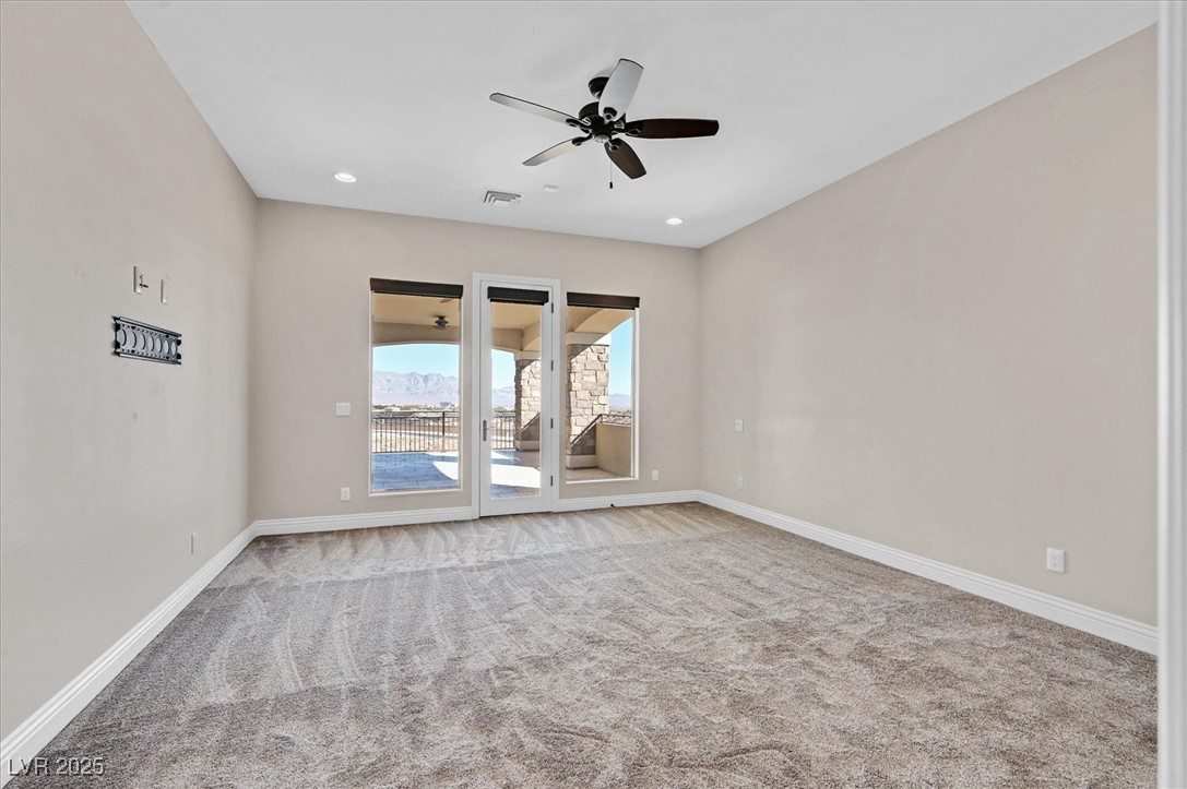 5790 Aspen Falls Circle Las Vegas, NV 89149 - Photo 39 of 61 Carpeted spare room with ceiling fan and recessed lighting