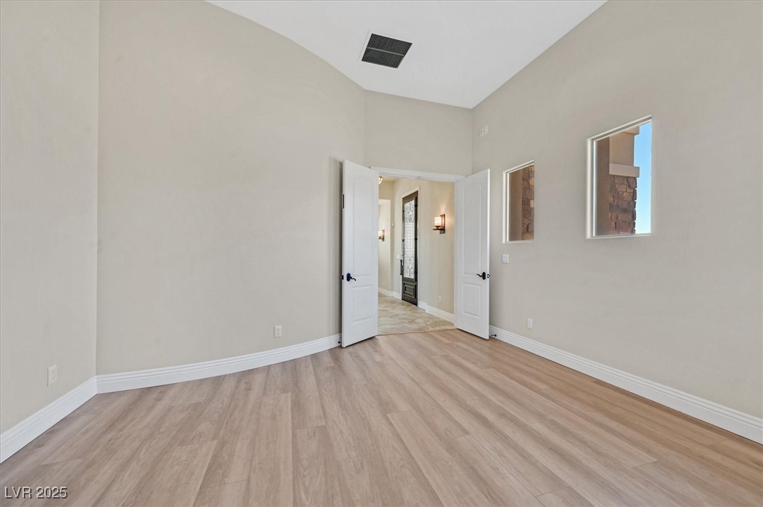 5790 Aspen Falls Circle Las Vegas, NV 89149 - Photo 47 of 61 Empty room with light wood finished floors and baseboards