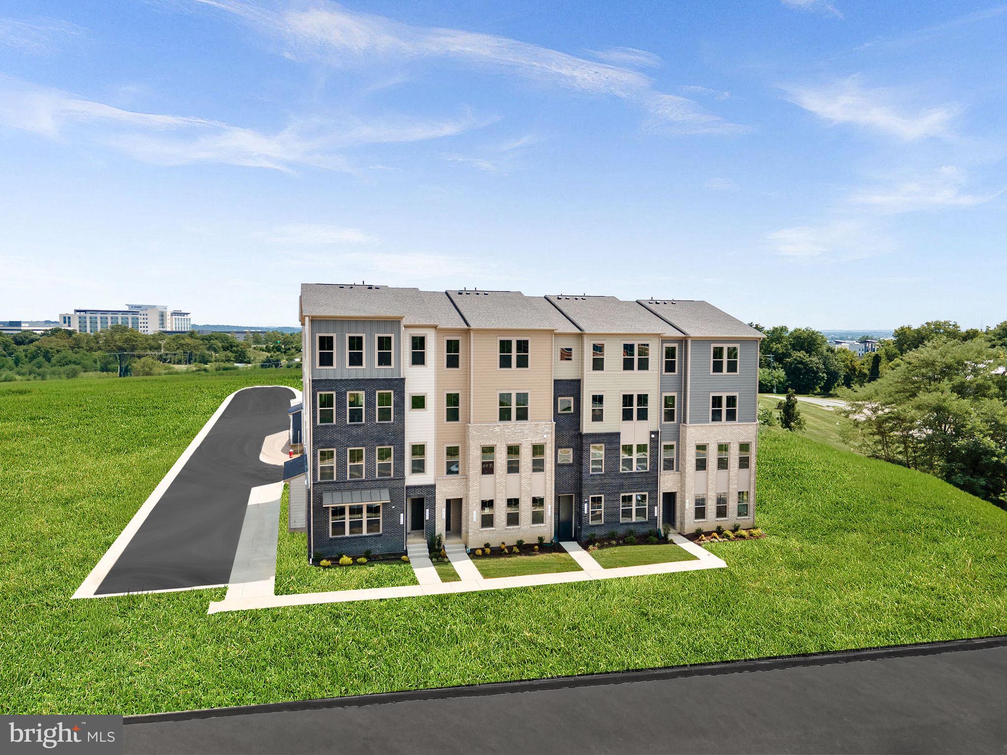 7 Sepia Square, Unit KA Ashburn, VA 20147 - Photo 12 of 19 a view of a big building with a big yard and large trees