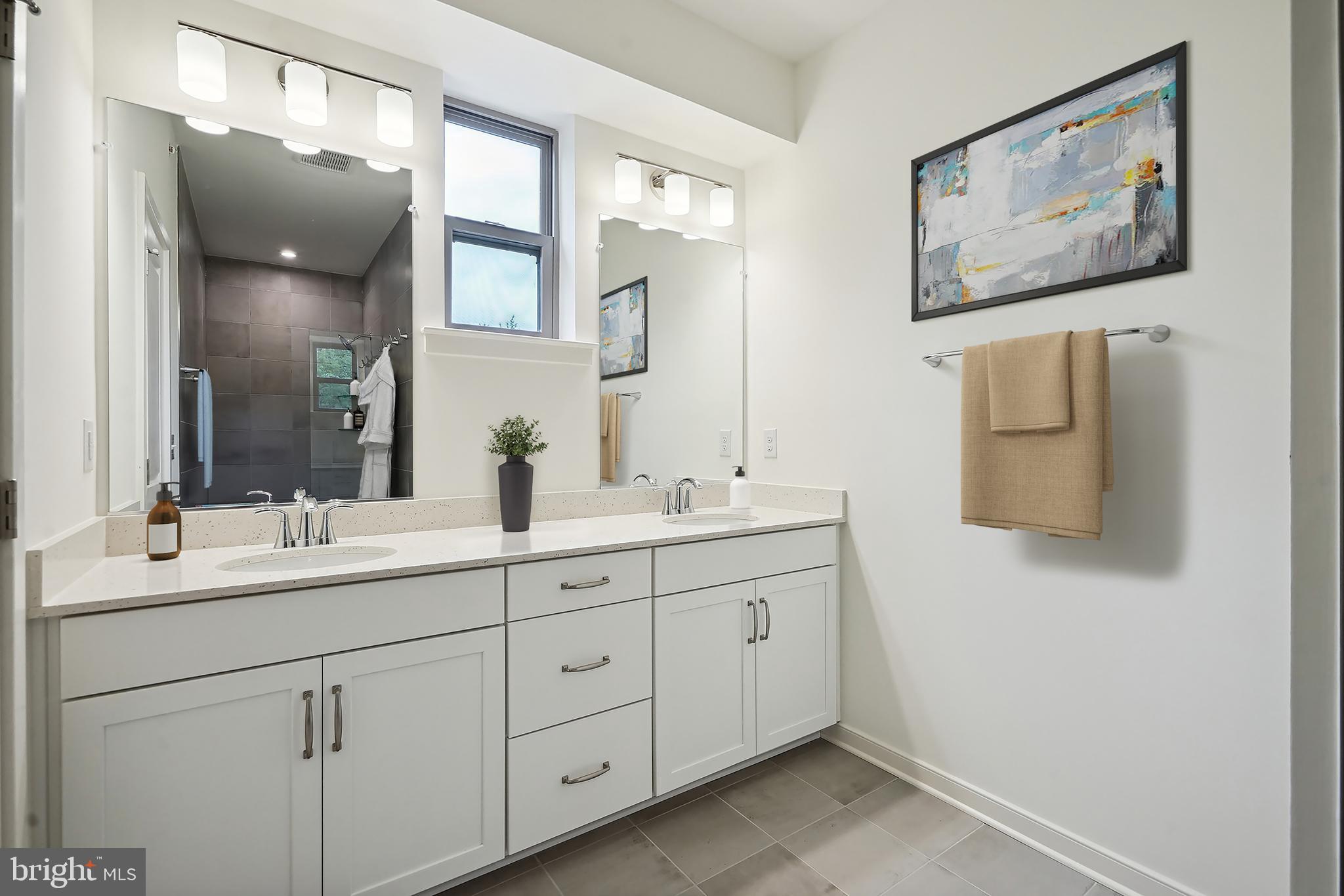 7 Sepia Square, Unit KA Ashburn, VA 20147 - Photo 5 of 19 a bathroom with a double vanity sink and mirror