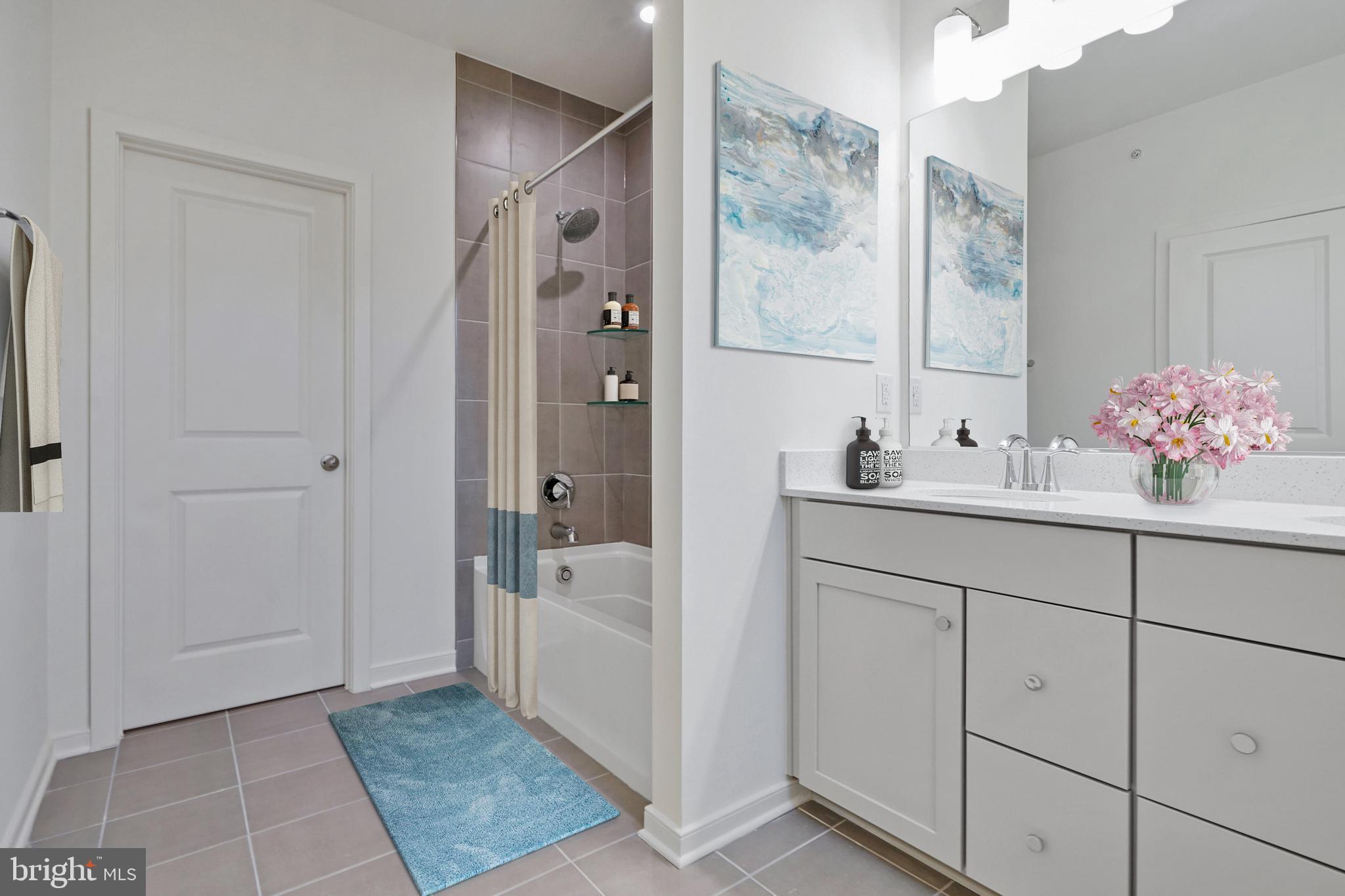 7 Sepia Square, Unit KA Ashburn, VA 20147 - Photo 9 of 19 a bathroom with a sink and mirror