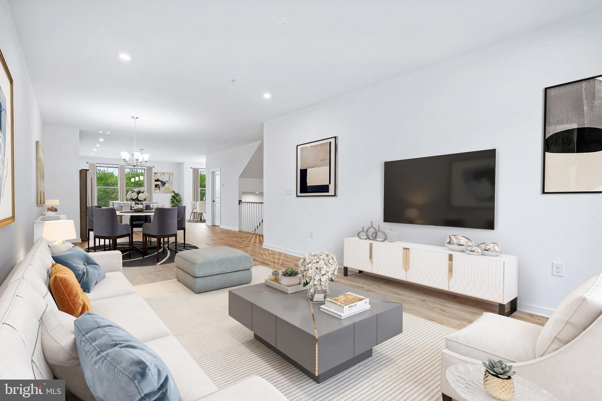 7 Sepia Square, Unit KA Ashburn, VA 20147 - Photo 10 of 19 a living room with furniture and a flat screen tv