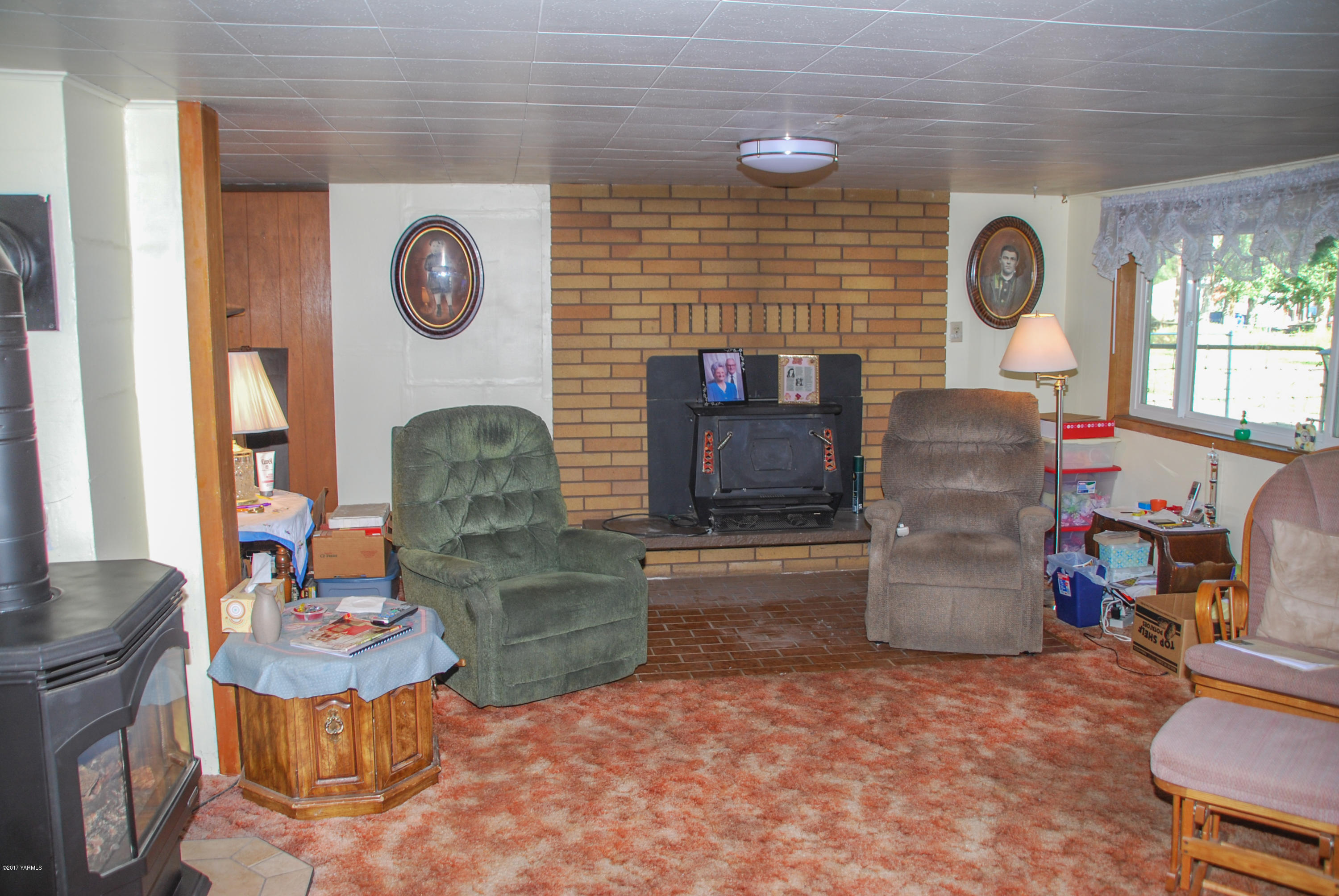 10210 Hughes Road Yakima, WA 98903 - Photo 8 of 21 a living room with furniture and a fireplace